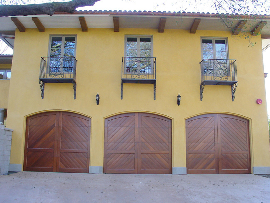 This is an example of a mediterranean attached three-car garage in Seattle.