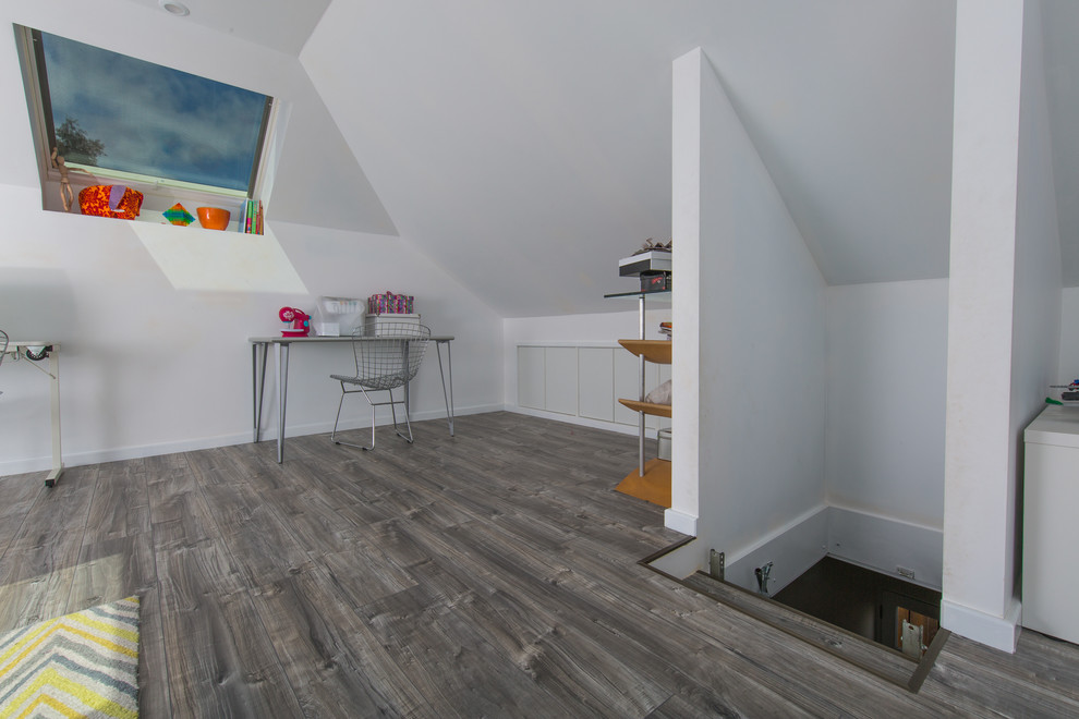 Mid-sized contemporary gender-neutral kids' room in Perth with white walls and vinyl floors.