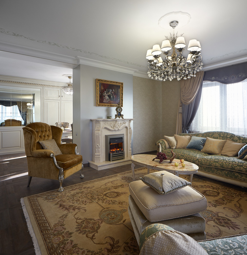 Design ideas for a mid-sized traditional formal enclosed living room in Yekaterinburg with grey walls, a standard fireplace and a stone fireplace surround.
