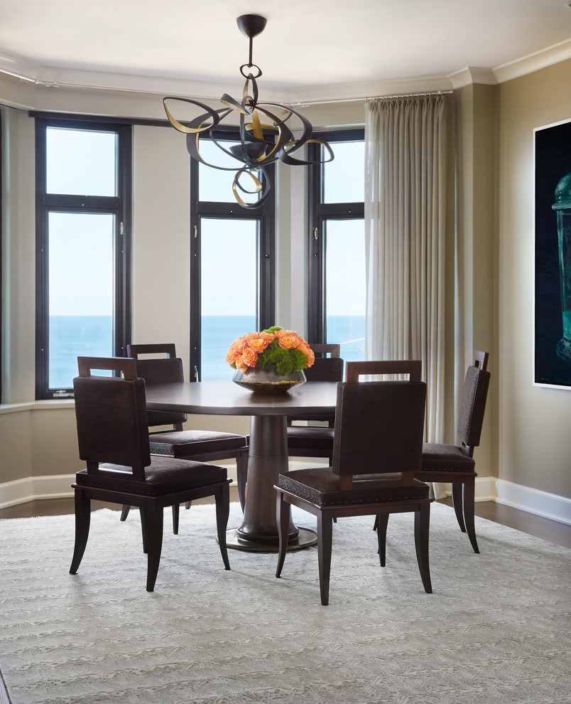 Example of a transitional dark wood floor dining room design in Chicago with beige walls