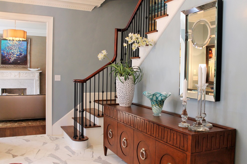Inspiration for a large transitional foyer in Other with blue walls, marble floors, a single front door and a medium wood front door.