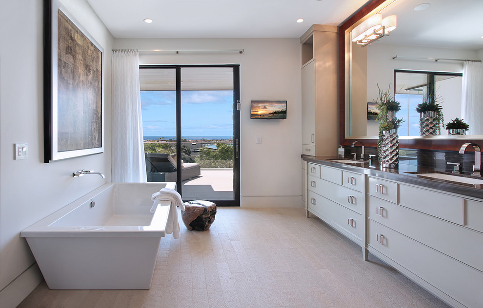 Trendy freestanding bathtub photo in Orange County with an undermount sink, white cabinets and recessed-panel cabinets