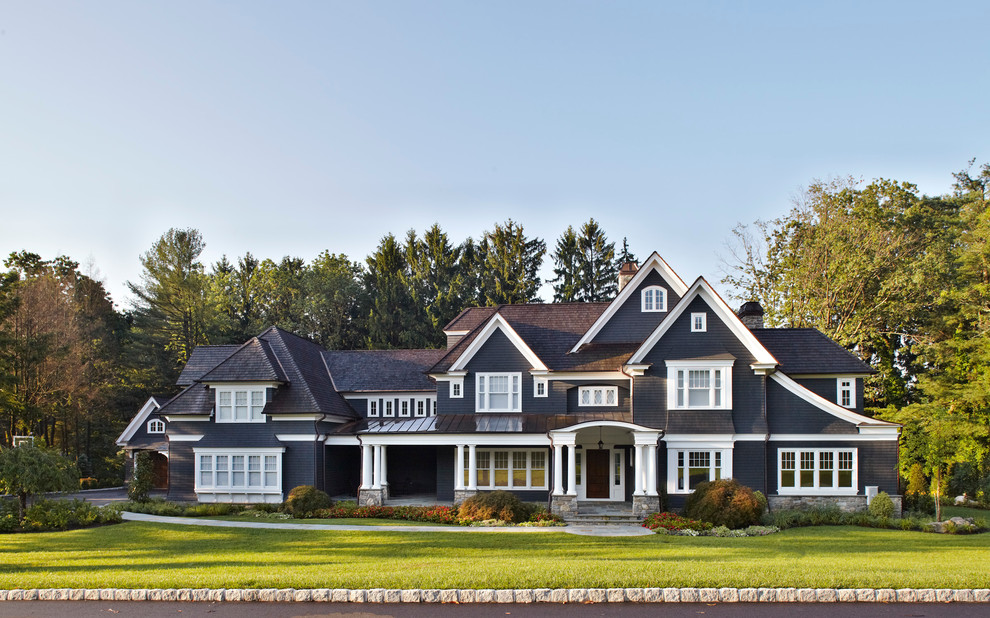 Design ideas for a large traditional three-storey black exterior in New York with a gable roof.