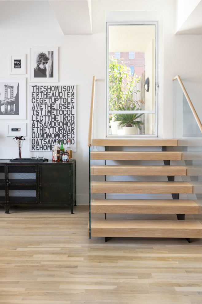 Staircase - small contemporary wooden straight open and wood railing staircase idea in New York