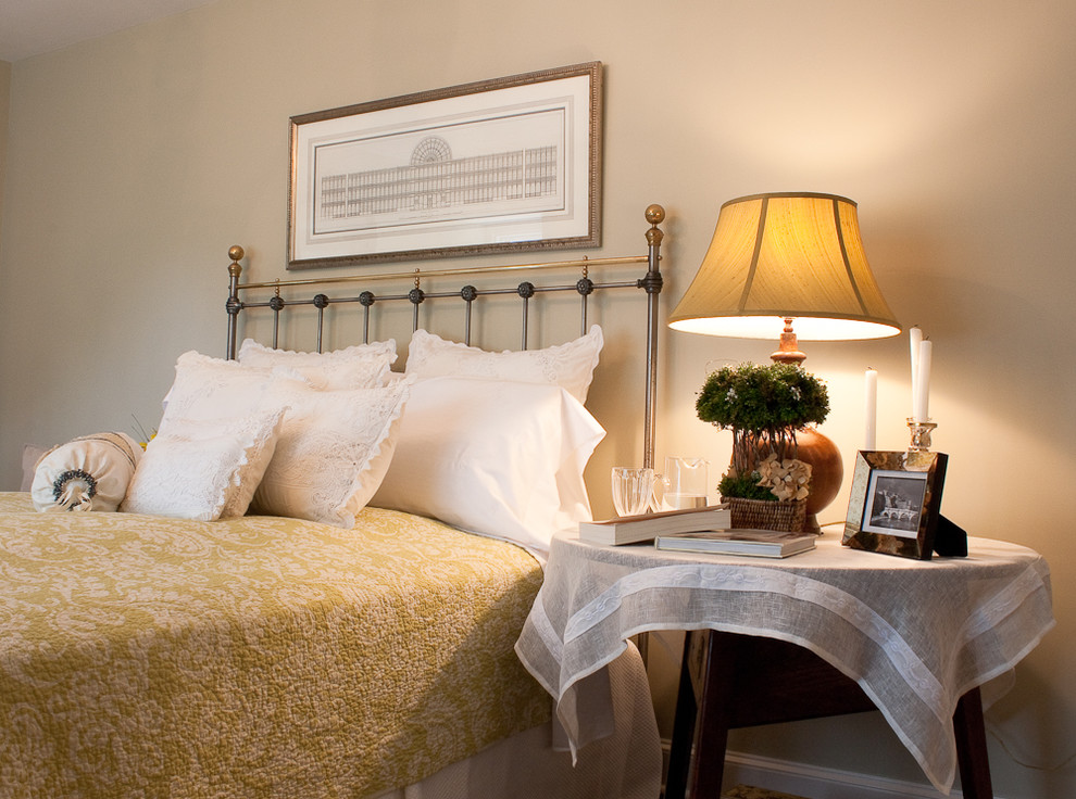 Inspiration for a traditional bedroom in Boston with beige walls.