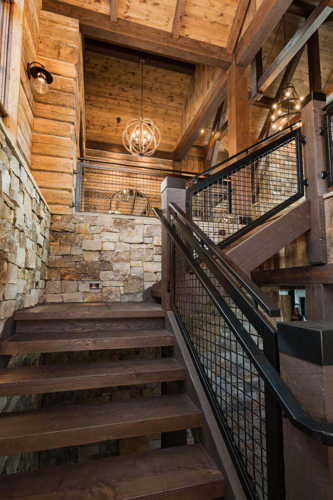 Design ideas for a large rustic wood l-shaped metal railing staircase in Denver.