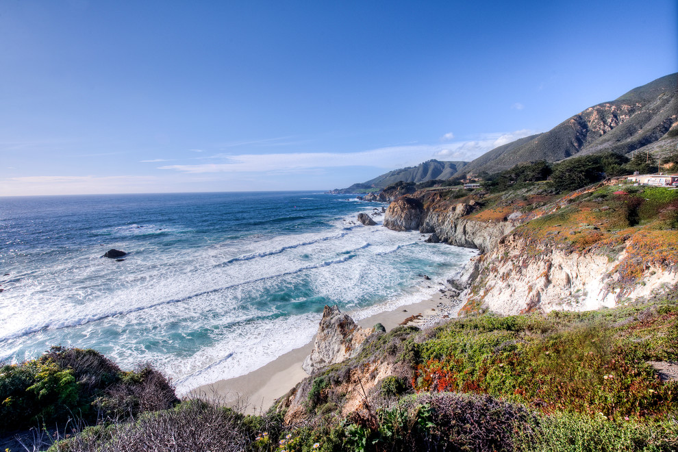 Big Sur Coast Ridge Estate - Breathtaking views of the incomparable Big Sur Coast, this classic Tuscan design of an Italian farmhouse, combined with a modern approach creates an ambiance of relaxed sophistication for this magnificent 95.73-acre, private coastal estate on California’s Coastal Ridge. Five-bedroom, 5.5-bath, 7,030 sq. ft. main house, and 864 sq. ft. caretaker house over 864 sq. ft. of garage and laundry facility. Commanding a ridge above the Pacific Ocean and Post Ranch Inn, this spectacular property has sweeping views of the California coastline and surrounding hills. “It’s as if a contemporary house were overlaid on a Tuscan farm-house ruin,” says decorator Craig Wright who created the interiors. The main residence was designed by renowned architect Mickey Muenning—the architect of Big Sur’s Post Ranch Inn, —who artfully combined the contemporary sensibility and the Tuscan vernacular, featuring vaulted ceilings, stained concrete floors, reclaimed Tuscan wood beams, antique Italian roof tiles and a stone tower. Beautifully designed for indoor/outdoor living; the grounds offer a plethora of comfortable and inviting places to lounge and enjoy the stunning views. No expense was spared in the construction of this exquisite estate.