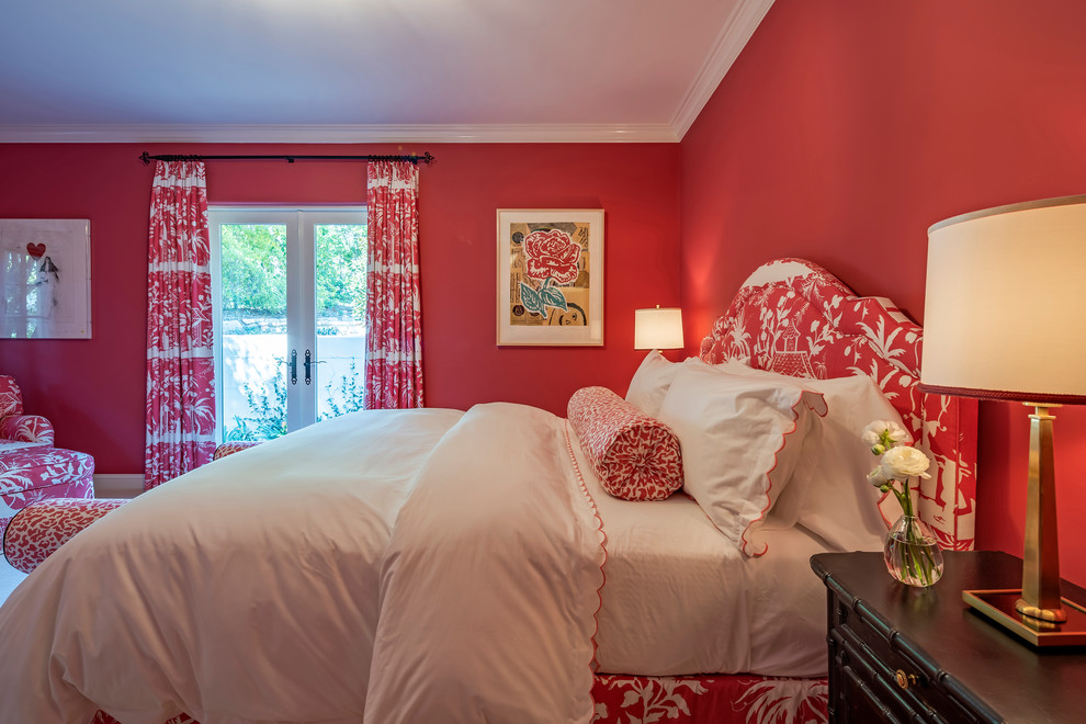 Photo of a large mediterranean guest bedroom in Santa Barbara with red walls, carpet, no fireplace and beige floor.