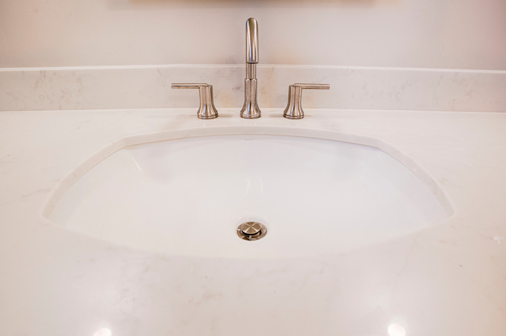 Example of a huge transitional master brown tile and porcelain tile porcelain tile freestanding bathtub design in Phoenix with shaker cabinets, white cabinets, a two-piece toilet, gray walls, an undermount sink and quartzite countertops