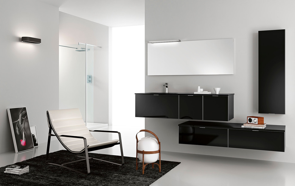 Inspiration for a small modern 3/4 bathroom in San Diego with an integrated sink, flat-panel cabinets, black cabinets, glass benchtops, a freestanding tub, a corner shower, a one-piece toilet, gray tile, ceramic tile, grey walls and slate floors.