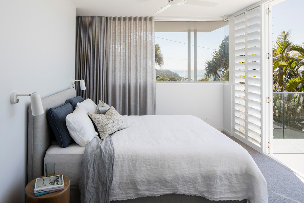 Photo of a contemporary bedroom in Sunshine Coast with white walls, carpet and grey floor.