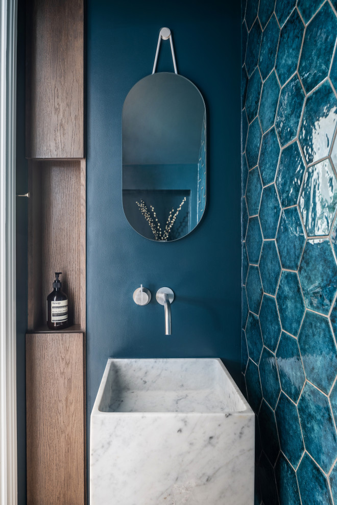 Inspiration for a transitional powder room remodel in London