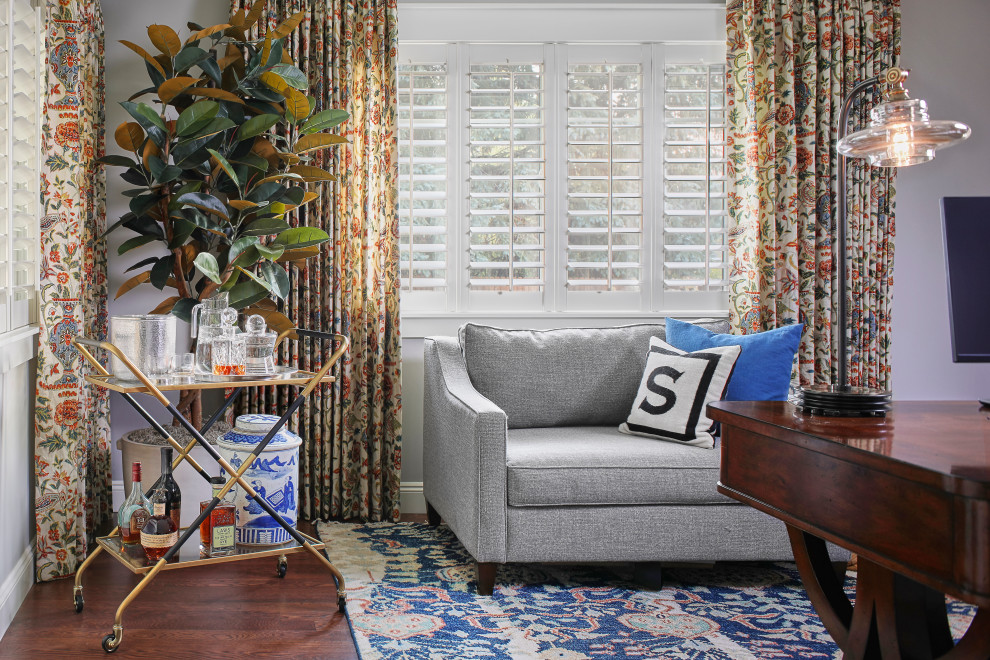 Example of a transitional home office design in Denver