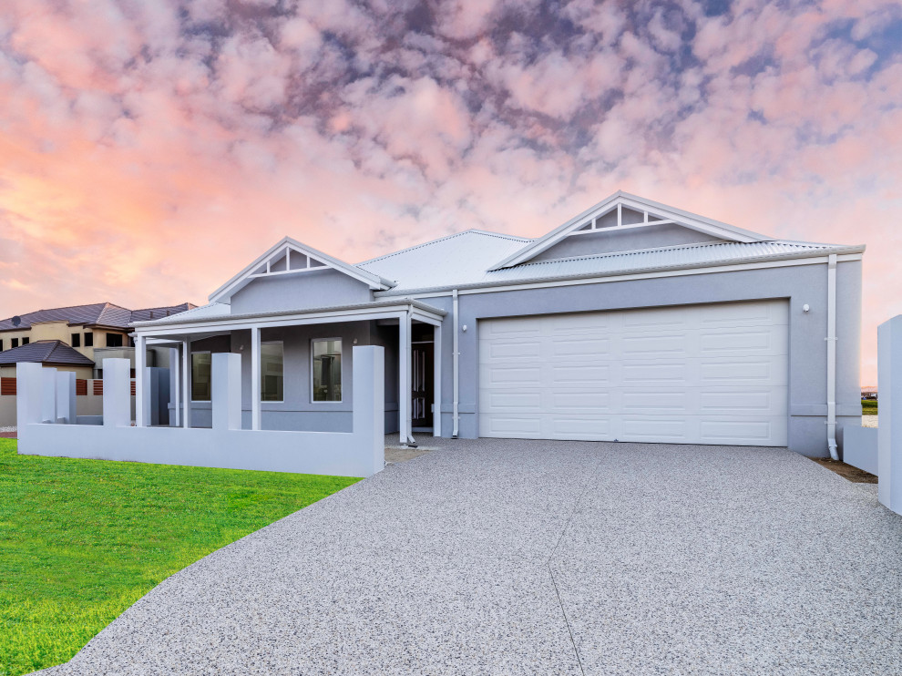 This is an example of a large one-storey white house exterior in Perth with a metal roof, a white roof and a hip roof.