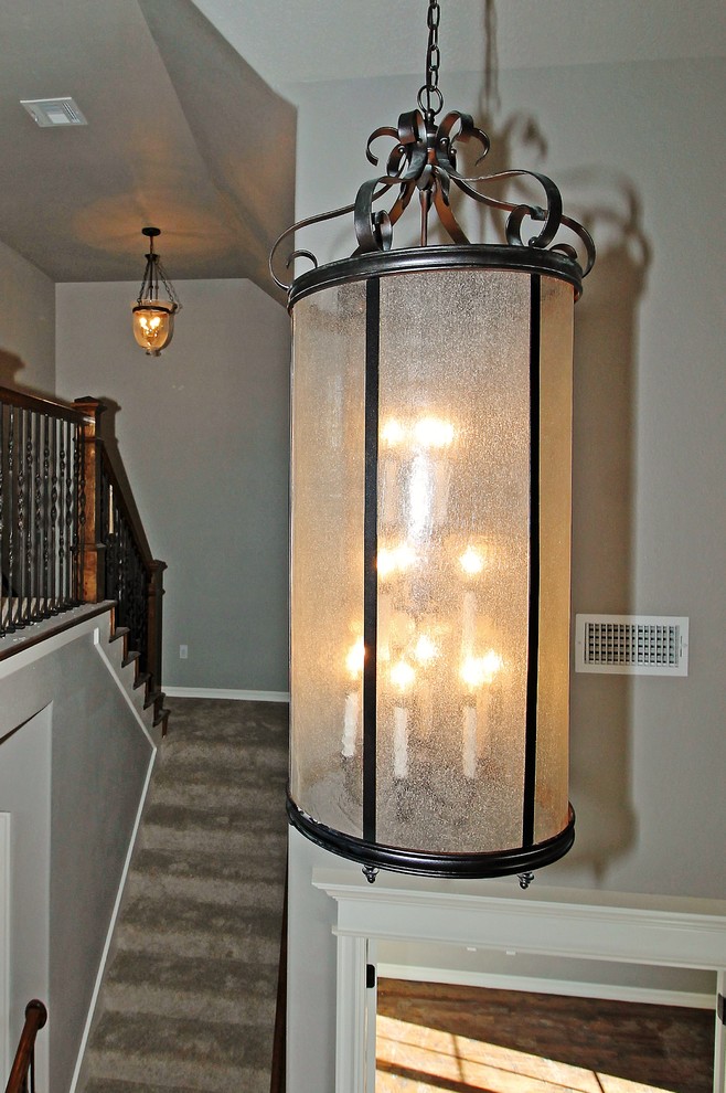 Hallway - mid-sized transitional carpeted hallway idea with gray walls