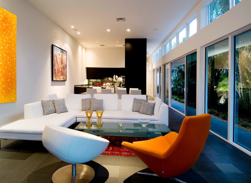This is an example of a mid-sized modern formal open concept living room in Miami with white walls and ceramic floors.