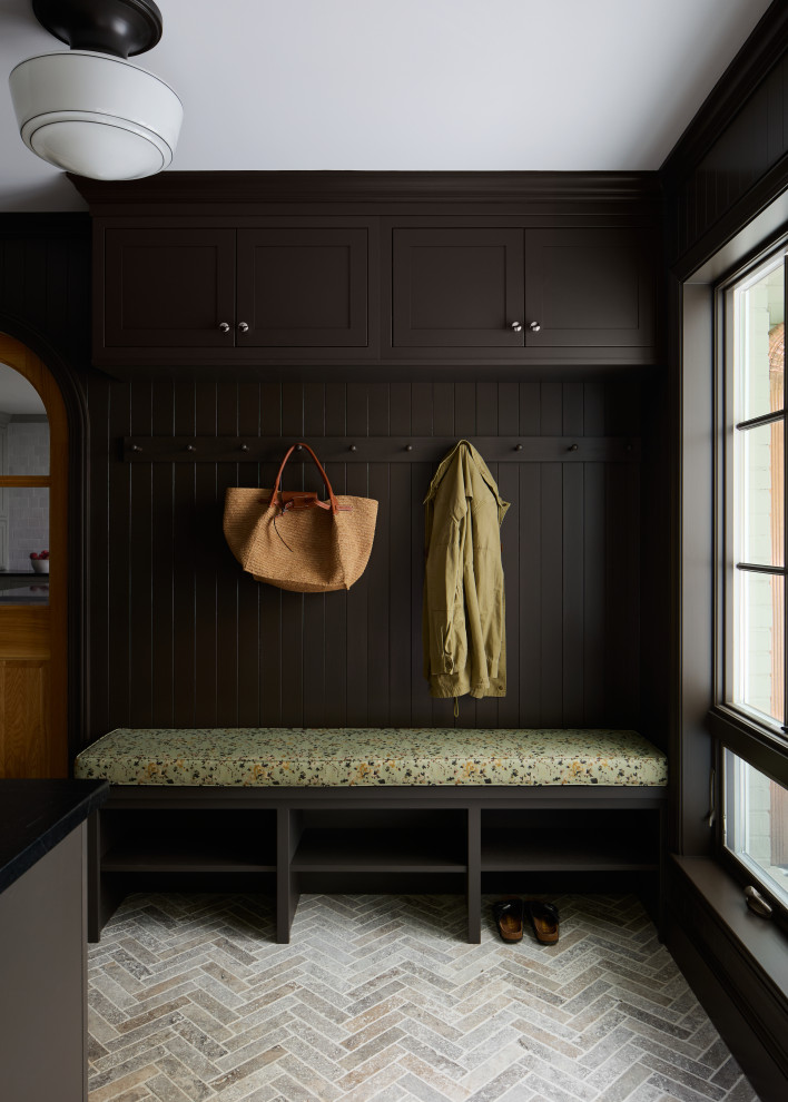 Example of a mid-sized transitional travertine floor and gray floor entryway design in DC Metro with brown walls