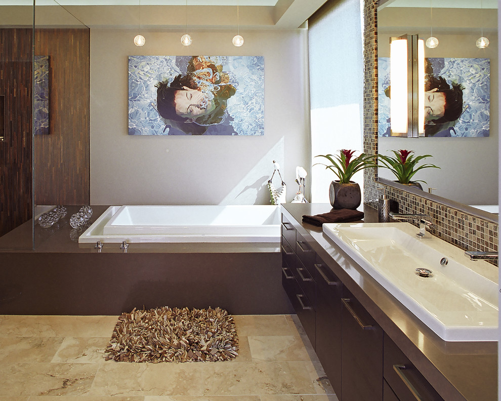 Design ideas for a contemporary bathroom in Los Angeles with a trough sink and brown benchtops.
