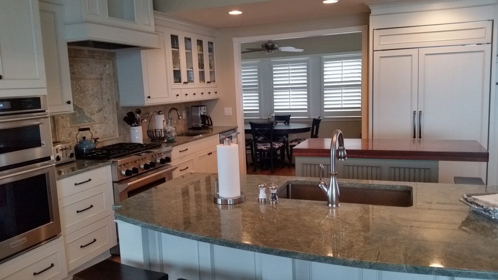 Kitchen - transitional kitchen idea with a single-bowl sink, shaker cabinets, white cabinets, marble countertops, stainless steel appliances and two islands