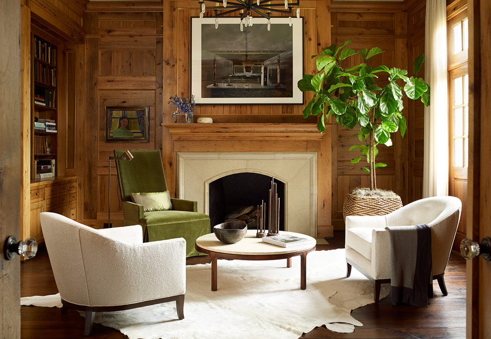Inspiration for a large traditional study room in Houston with brown walls, dark hardwood floors, a standard fireplace, a stone fireplace surround, a built-in desk and brown floor.