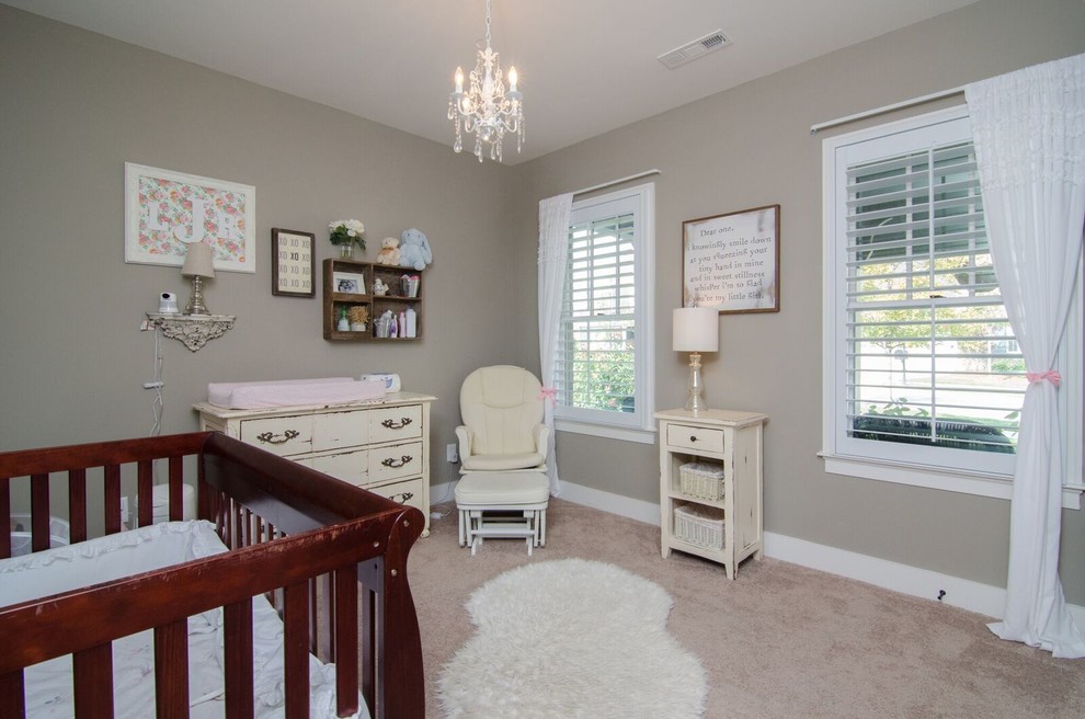 Mid-sized traditional nursery in Atlanta with grey walls, carpet and brown floor for girls.