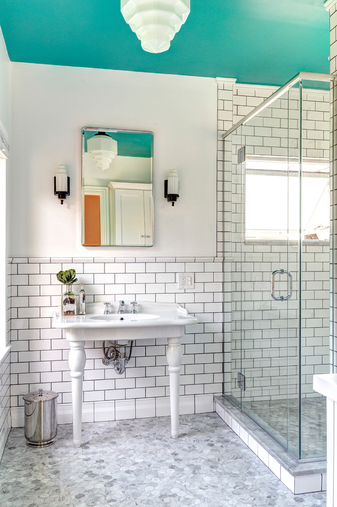 This is an example of a small traditional master bathroom in Columbus with a console sink, white tile, subway tile, marble floors, an alcove shower and white walls.