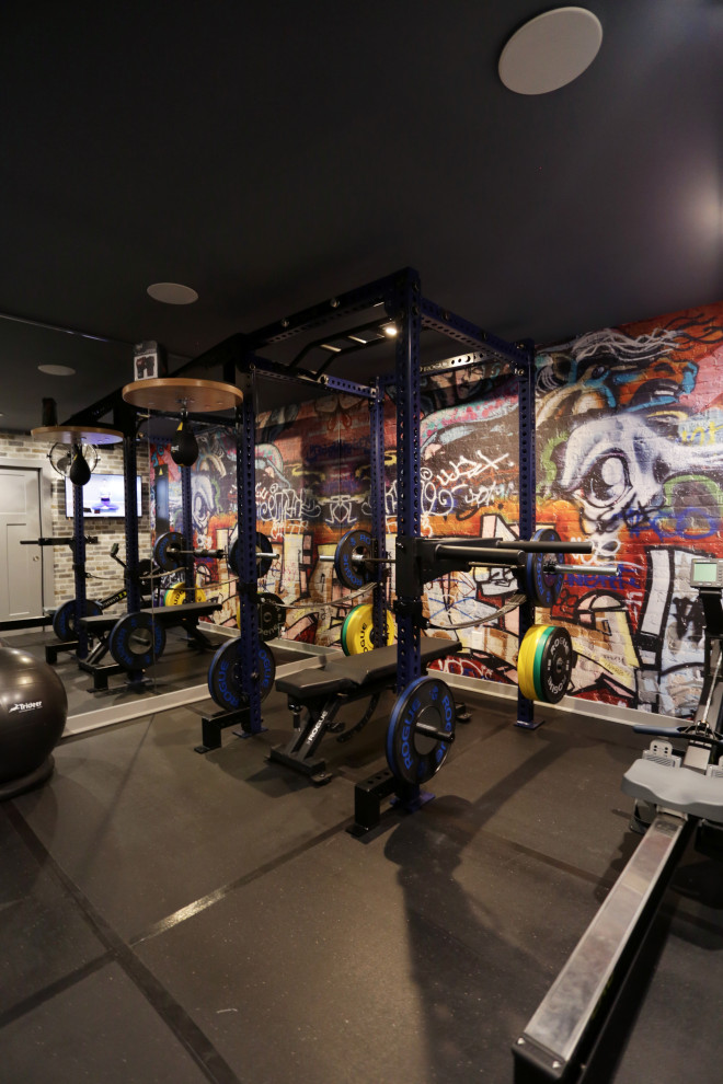 Photo of a small contemporary multipurpose gym in DC Metro with grey walls and black floor.