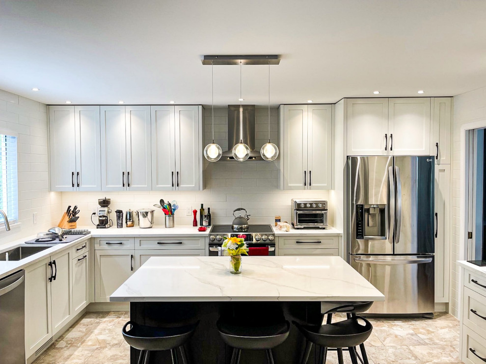 Example of a transitional kitchen design in Vancouver