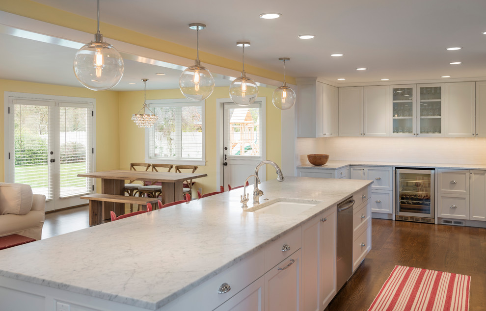 This is an example of a contemporary kitchen in Seattle with shaker cabinets and marble benchtops.