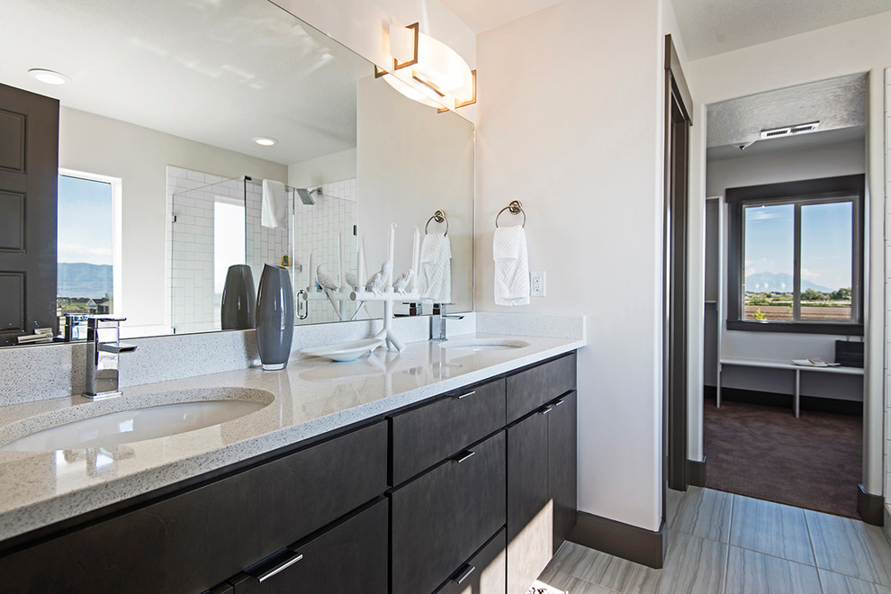 Contemporary master bathroom in Salt Lake City with grey cabinets, quartzite benchtops, a corner shower, beige tile, ceramic tile, white walls and ceramic floors.
