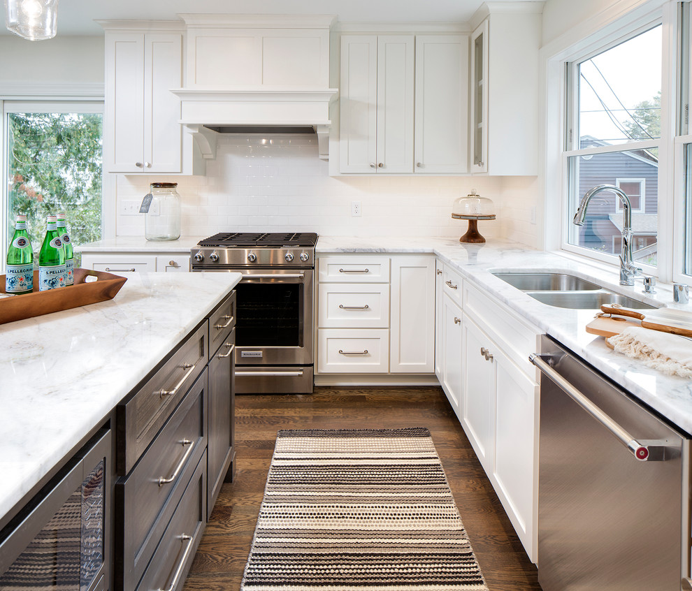 Eat-in kitchen - mid-sized transitional l-shaped dark wood floor eat-in kitchen idea in Minneapolis with an undermount sink, shaker cabinets, white cabinets, marble countertops, stainless steel appliances and an island