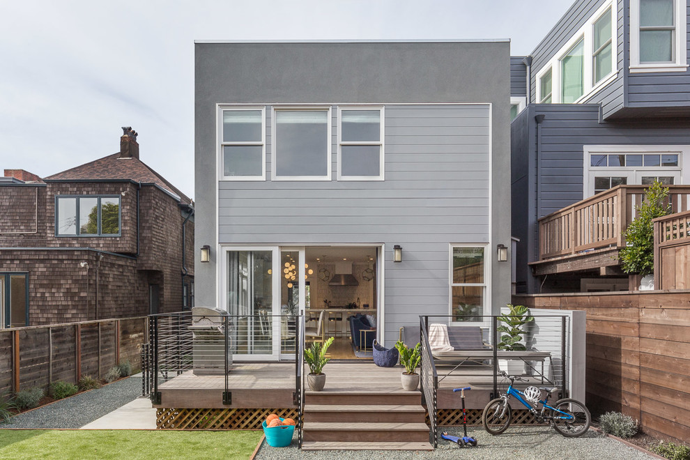 Inspiration for a contemporary two-storey grey house exterior in San Francisco with mixed siding and a flat roof.