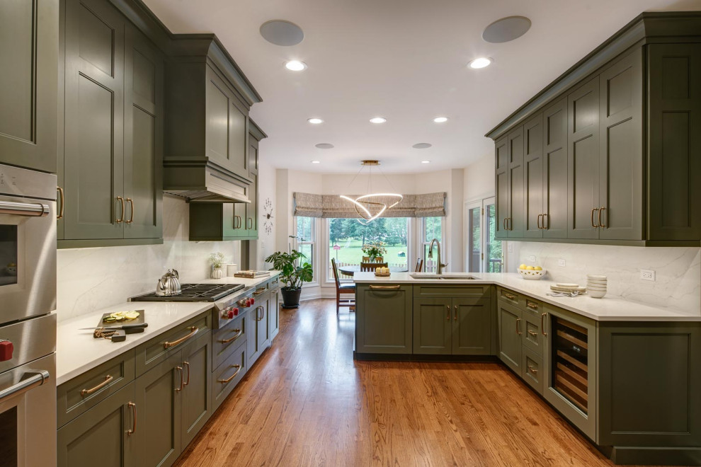 Photo of a large classic l-shaped kitchen/diner in Chicago with recessed-panel cabinets and green cabinets.