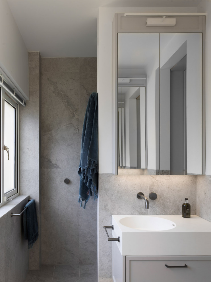 Photo of a large contemporary bathroom in Sydney with shaker cabinets, grey cabinets, porcelain tile, porcelain floors, engineered quartz benchtops, grey floor, a single vanity and a floating vanity.