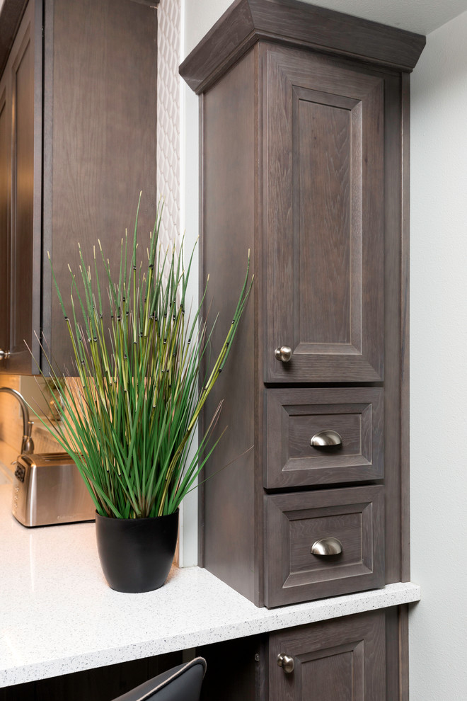 Eat-in kitchen - mid-sized transitional l-shaped vinyl floor and gray floor eat-in kitchen idea with a farmhouse sink, recessed-panel cabinets, gray cabinets, quartz countertops, white backsplash, ceramic backsplash, stainless steel appliances, no island and white countertops
