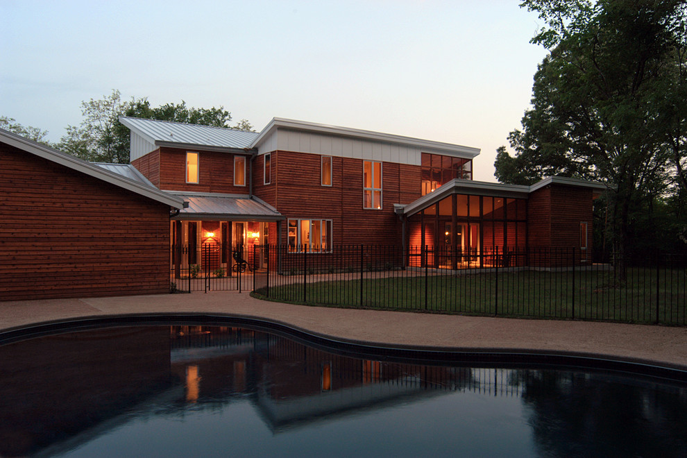 Contemporary exterior in Nashville with wood siding.