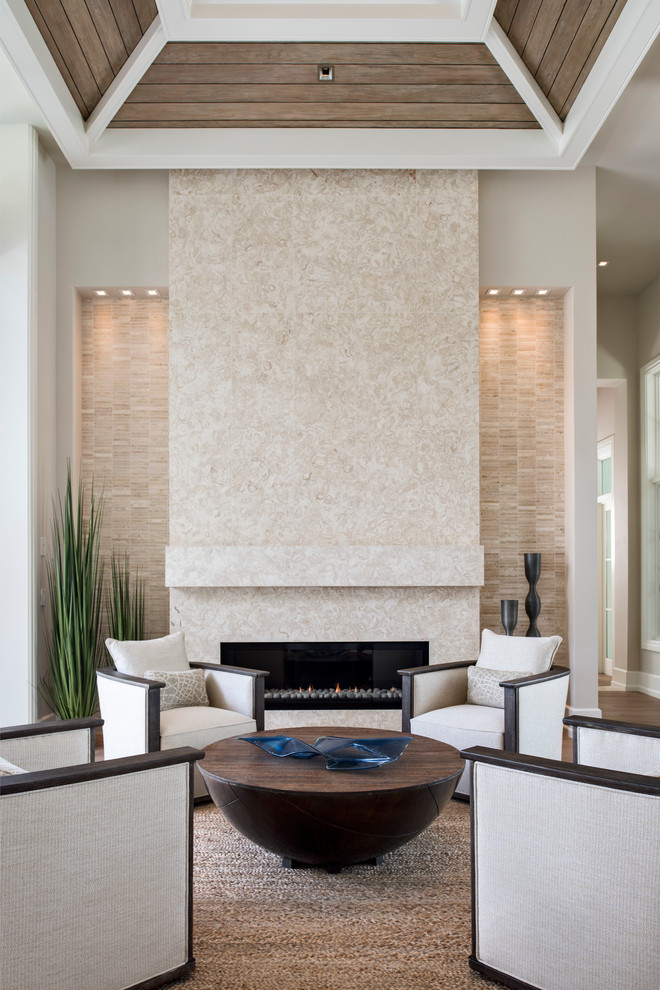 Large contemporary open concept living room in Miami with a tile fireplace surround.
