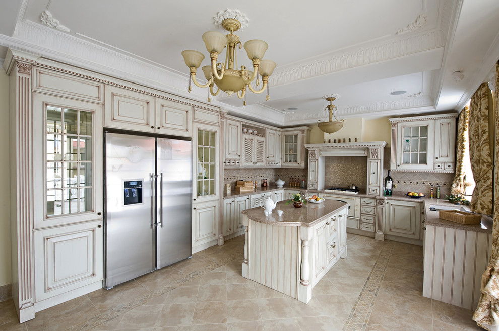 Inspiration for a large u-shaped ceramic tile eat-in kitchen remodel with raised-panel cabinets, white cabinets, granite countertops, beige backsplash, ceramic backsplash, stainless steel appliances and an island
