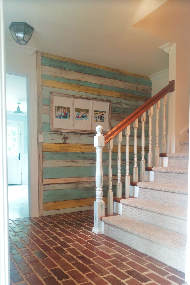 Large country wood straight staircase in St Louis with painted wood risers.