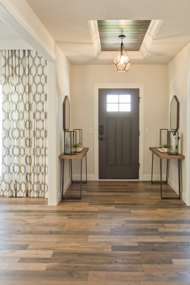 Design ideas for a traditional foyer in Other with medium hardwood flooring, a single front door and brown floors.