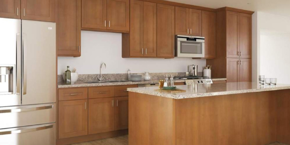Mid-sized transitional galley open concept kitchen photo with a drop-in sink, shaker cabinets, medium tone wood cabinets, granite countertops, stainless steel appliances, an island and gray countertops