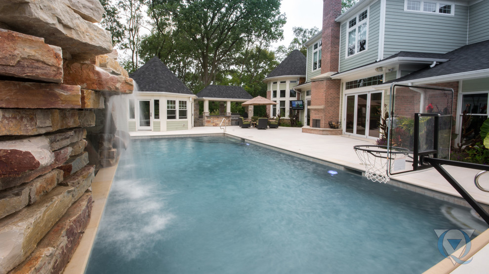 Example of a large mountain style backyard rectangular lap water slide design in Chicago