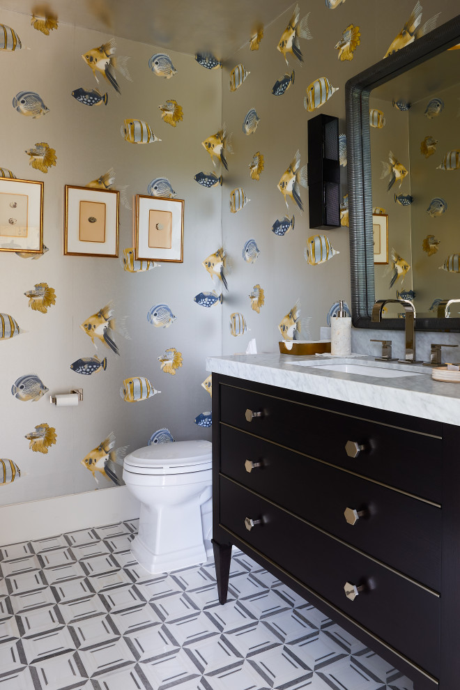 Inspiration for a medium sized contemporary cloakroom in New York with flat-panel cabinets, black cabinets, a two-piece toilet, multi-coloured walls, mosaic tile flooring, a submerged sink, marble worktops, white floors, white worktops, a freestanding vanity unit, a wallpapered ceiling and wallpapered walls.