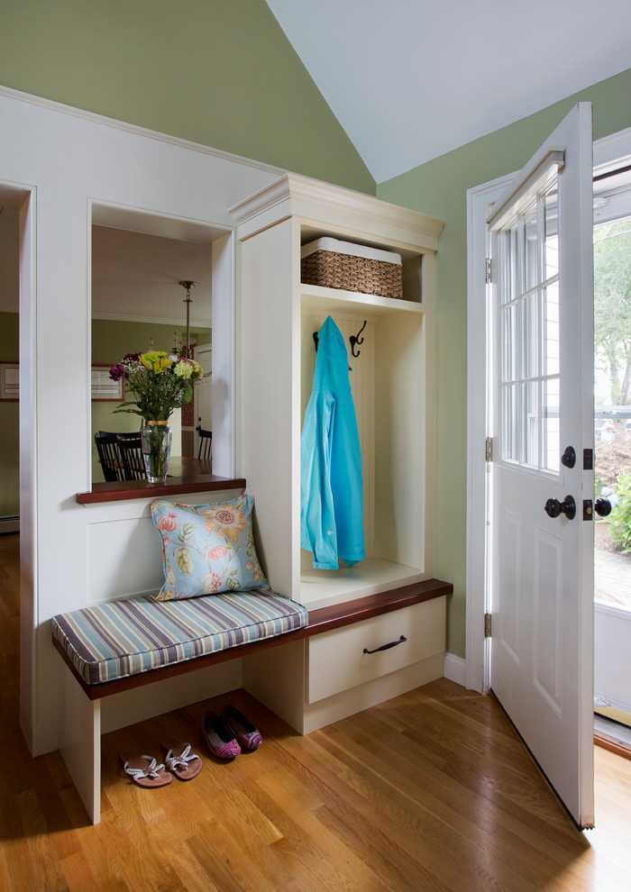 Inspiration for a small traditional mudroom in Boston with green walls, medium hardwood floors, a single front door and a white front door.