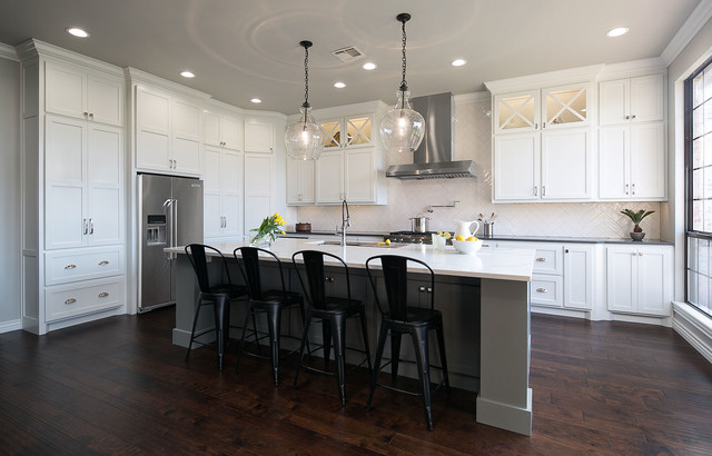 White Kitchen With Gray Island And Dark Floors Transitional