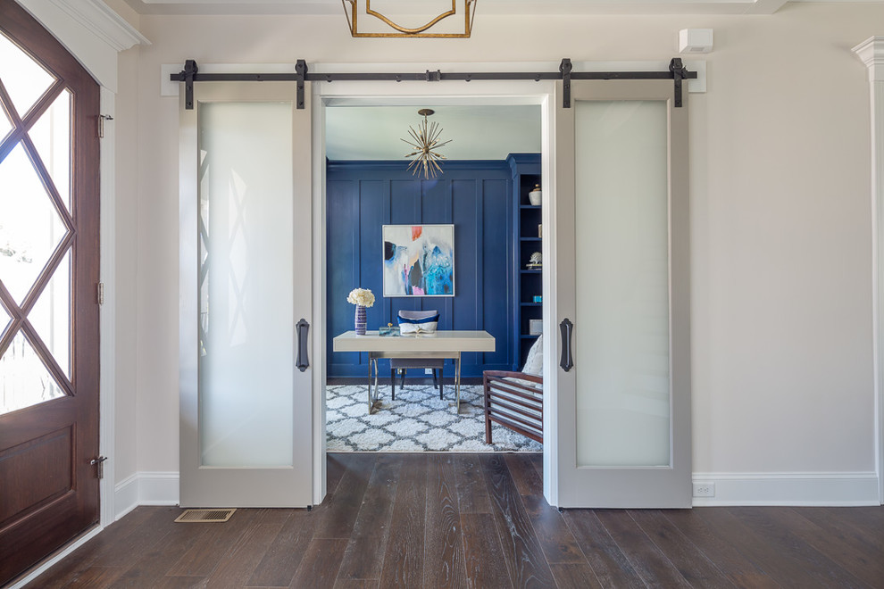 Inspiration for a mid-sized country foyer in Raleigh with grey walls, dark hardwood floors, a double front door, a dark wood front door and brown floor.
