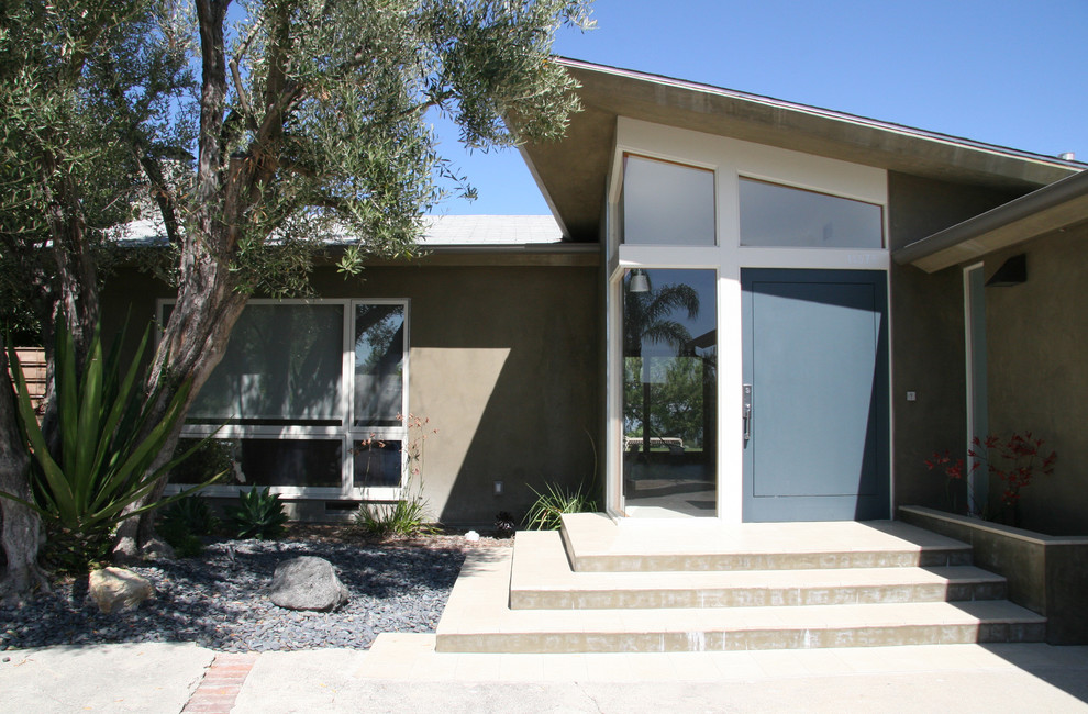 Contemporary entryway in Los Angeles with a single front door and a blue front door.