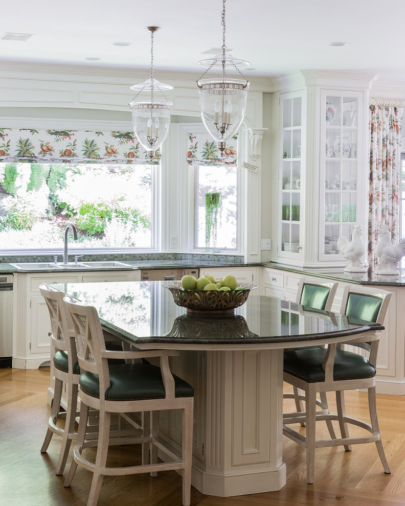 Inspiration for a mid-sized traditional l-shaped eat-in kitchen in Boston with with island, a triple-bowl sink, beaded inset cabinets, white cabinets, granite benchtops, stainless steel appliances, light hardwood floors, window splashback, beige floor and green benchtop.