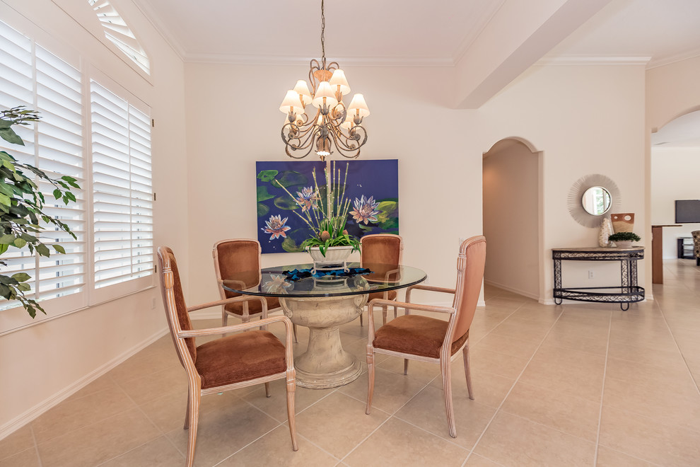 This is an example of an expansive contemporary dining room in Tampa with beige walls and ceramic floors.
