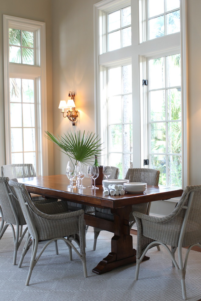 This is an example of a beach style dining room in Charleston.